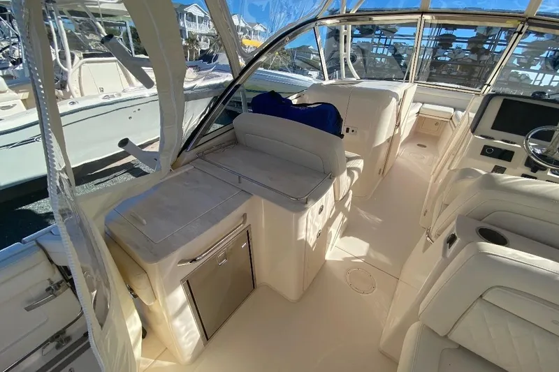 Slide: The Image of 2020 Grady-White Freedom 285 boat interior with seating and helm station. - 8