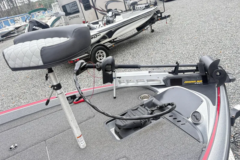 Slide: The Image of 2022 Triton 179 TrX boat with Minn Kota trolling motor and cushioned seat. - 10
