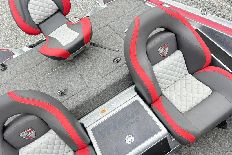 Slide: The Image of 2022 Triton 179 TrX boat seats with red and gray quilted design. - 11