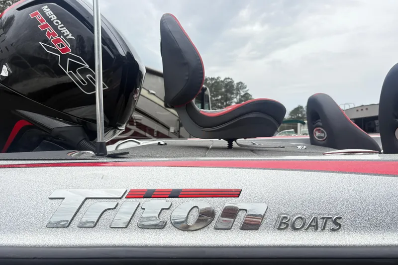Slide: The Image of 2022 Triton 179 TrX boat with Mercury Pro XS engine, featuring sleek design and comfortable seating. - 14