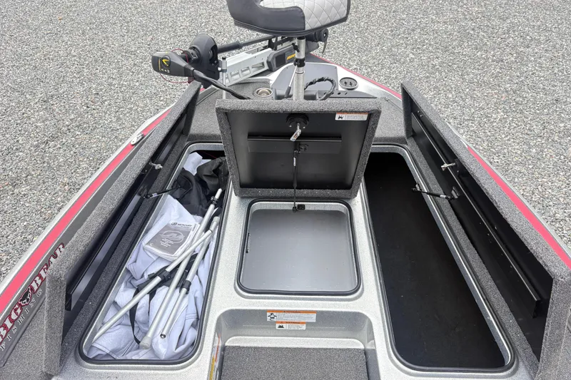 Slide: The Image of 2022 Triton 179 TrX boat storage compartments with fishing gear and equipment. - 6