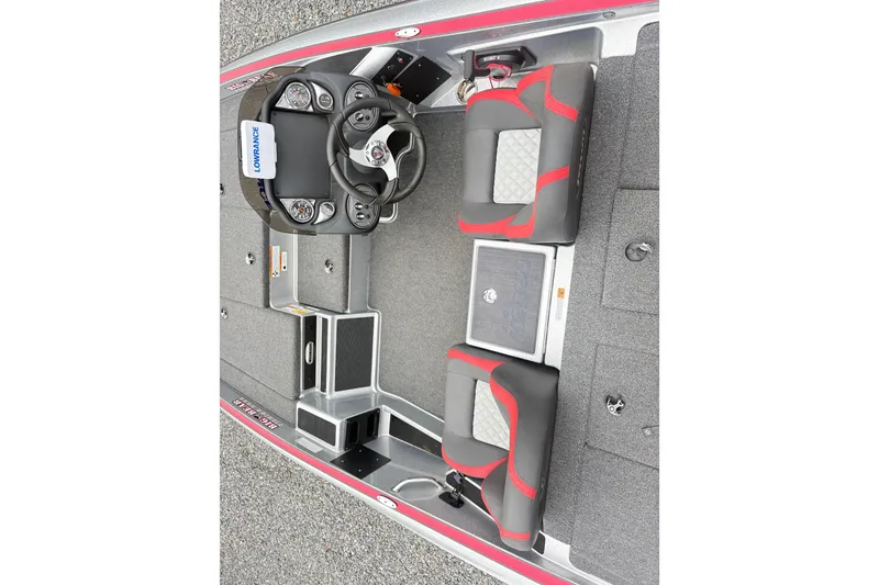 Slide: The Image of 2022 Triton 179 TrX boat interior with steering wheel, seats, and control panel. - 7
