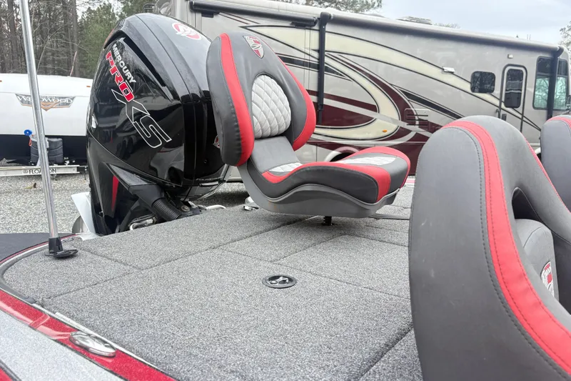 Slide: The Image of 2022 Triton 179 TrX boat with Mercury Pro XS engine and red-gray seating. - 8