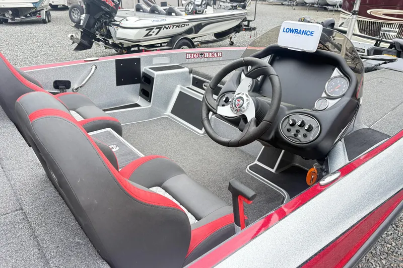 Slide: The Image of 2022 Triton 179 TrX boat interior with steering wheel and dashboard controls. - 9