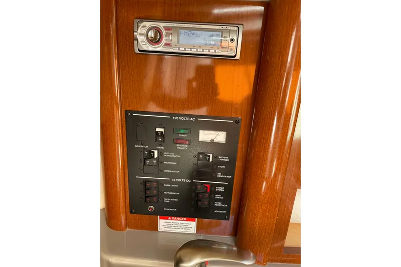 Slide: The Image of Control panel of a 2011 Sea Ray 240 Sundancer boat with stereo system. - 21