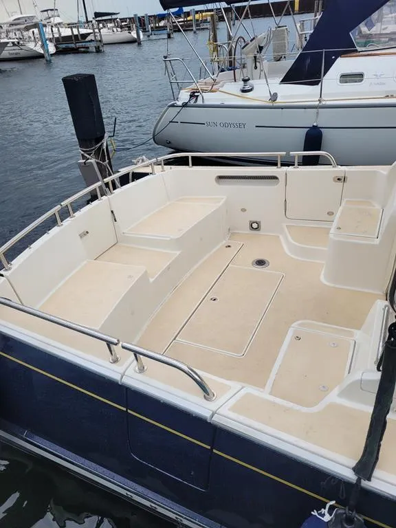 Slide: The Image of 2013 MJM 36z Downeast boat with spacious deck, docked at marina. - 10