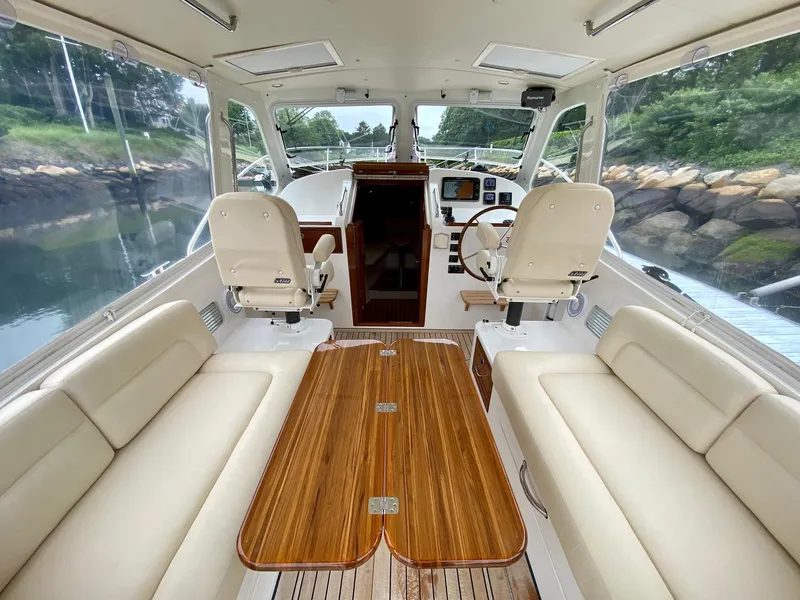 Slide: The Image of Interior of 2013 MJM 36z Downeast boat with elegant seating and wooden table. - 17