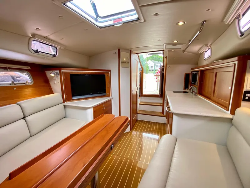 Slide: The Image of Interior of 2013 MJM 36z Downeast yacht with elegant seating and wooden finishes. - 20