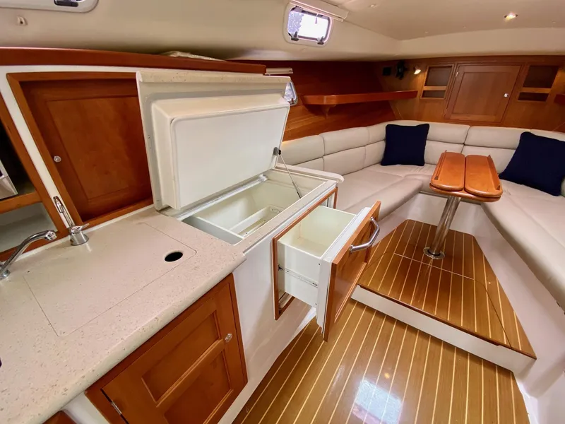 Slide: The Image of Luxurious 2013 MJM 36z Downeast yacht interior with kitchenette and cozy seating area. - 22