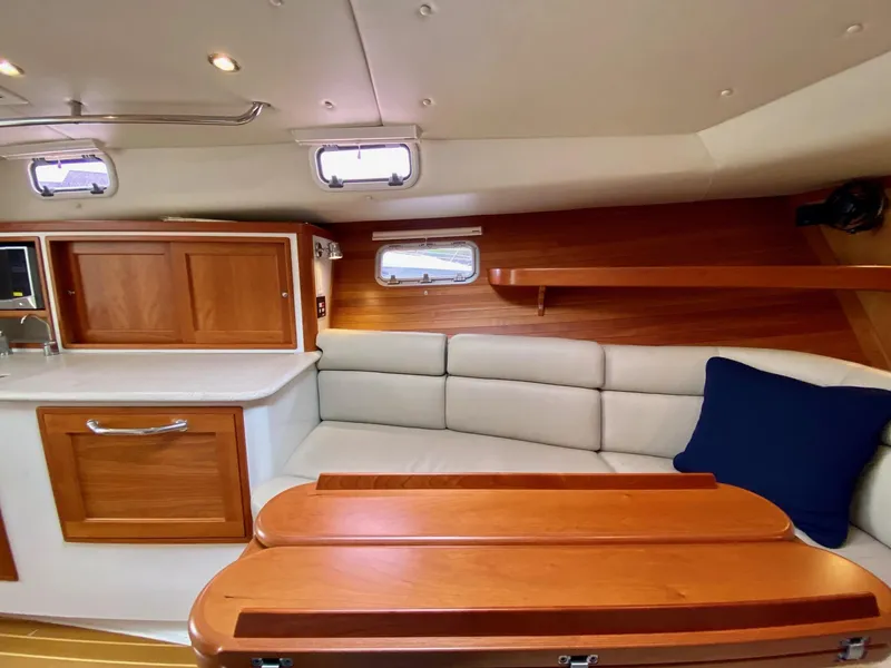 Slide: The Image of Interior of 2013 MJM 36z Downeast yacht with wooden cabinetry and cushioned seating. - 31