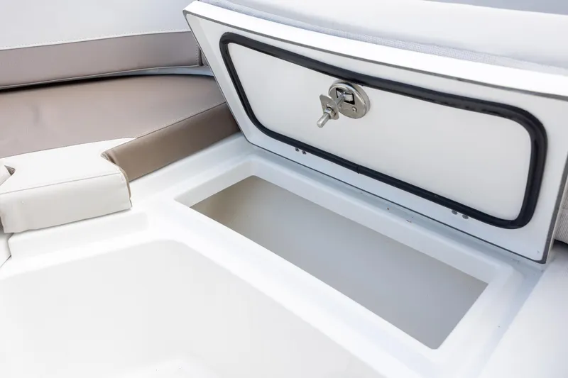 Slide: The Image of Storage compartment on a 2019 Blackfin 212 CC boat, featuring cushioned seating. - 13