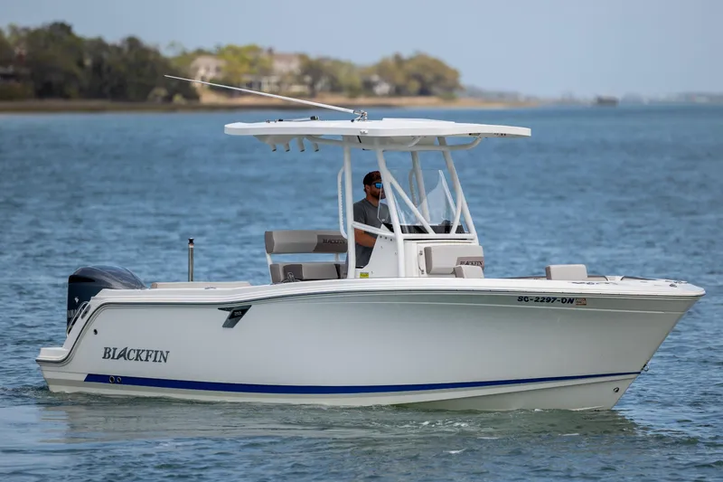 Slide: The Image of 2019 Blackfin 212 CC boat cruising on calm waters. - 2