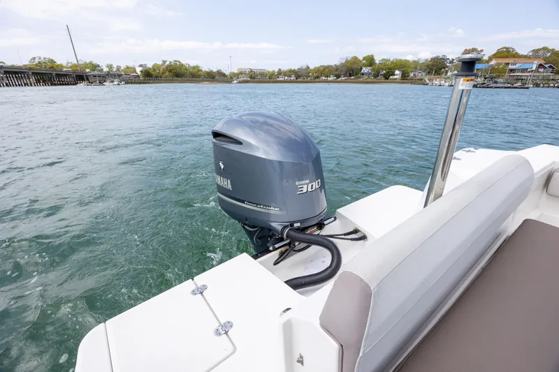 Slide: The Image of 2019 Blackfin 212 CC boat with Yamaha 300 outboard motor on calm water. - 23