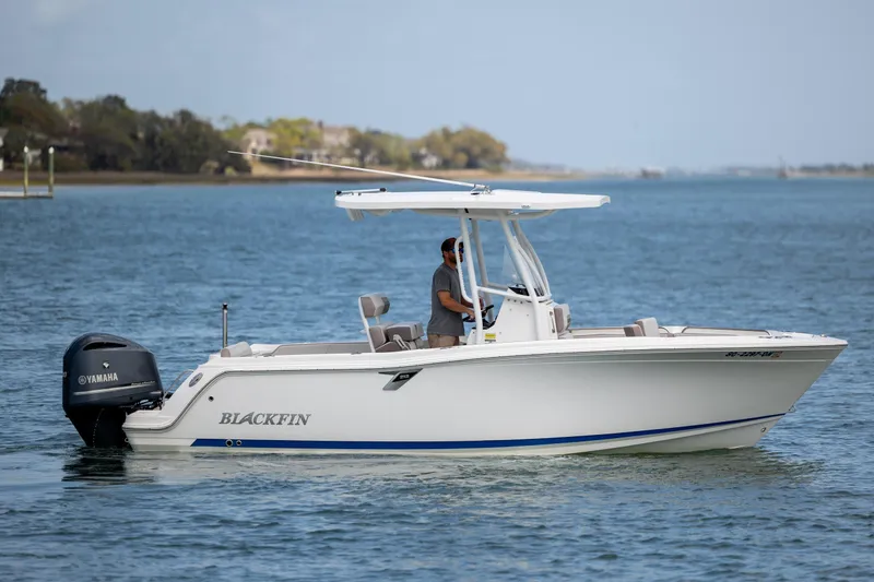 Slide: The Image of 2019 Blackfin 212 CC boat cruising on calm waters with Yamaha engine. - 3