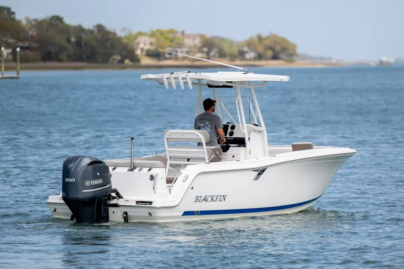 Slide: The Image of 2019 Blackfin 212 CC boat cruising on a calm lake with Yamaha engine. - 5