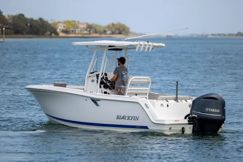 Slide: The Image of 2019 Blackfin 212 CC boat with Yamaha engine cruising on calm water. - 7