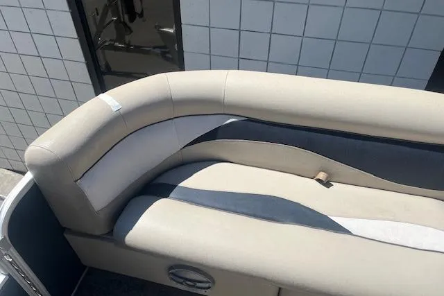 Slide: The Image of 2015 Godfrey Sweetwater 2286 C boat seating with beige and gray upholstery. - 10