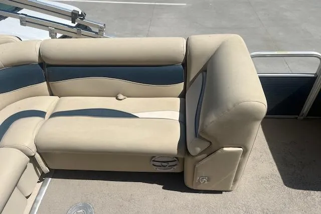 Slide: The Image of 2015 Godfrey Sweetwater 2286 C boat seating, beige and blue upholstery, spacious and comfortable design. - 12