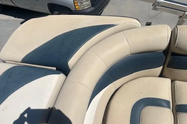 Slide: The Image of 2015 Godfrey Sweetwater 2286 C boat seating with blue and beige upholstery. - 13