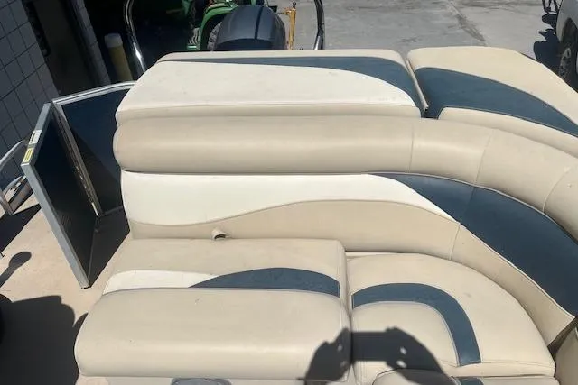 Slide: The Image of 2015 Godfrey Sweetwater 2286 C boat seats with beige and blue upholstery. - 14