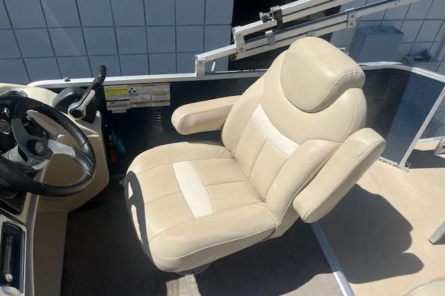Slide: The Image of Captain's chair on 2015 Godfrey Sweetwater 2286 C pontoon boat, beige upholstery. - 16