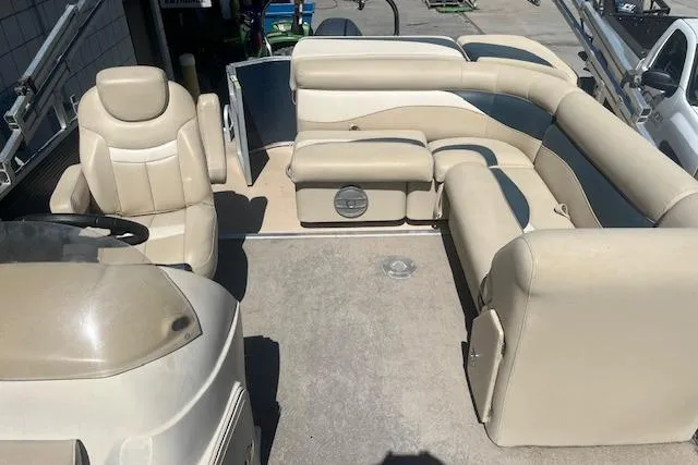 Slide: The Image of 2015 Godfrey Sweetwater 2286 C pontoon boat with beige seating and spacious deck. - 19