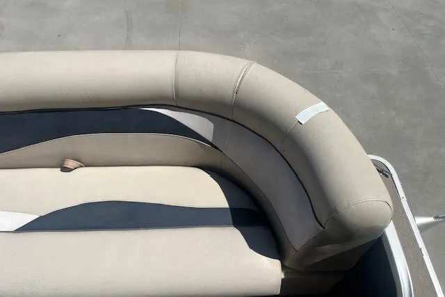 Slide: The Image of 2015 Godfrey Sweetwater 2286 C boat seating, beige and navy upholstery, top view. - 8