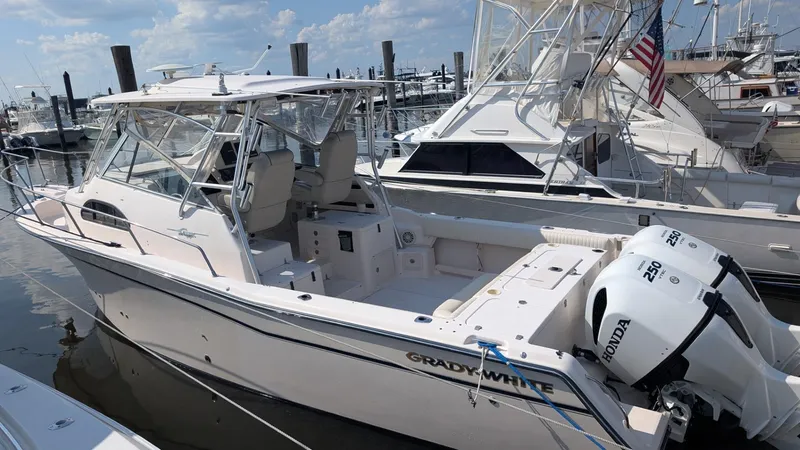The Image of 2006 Grady-White Marlin 300 boat docked with twin Honda 250 engines. - 0