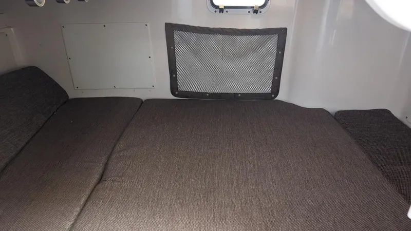Slide: The Image of Interior cabin of 2006 Grady-White Marlin 300 boat with cushioned bed. - 14