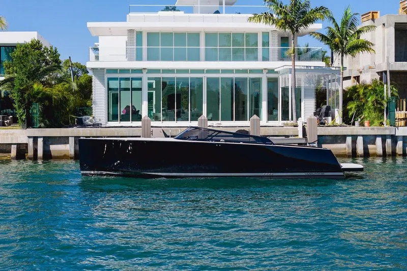 The Image of VanDutch 40.2 yacht docked by modern waterfront home, 2021 model. - 0