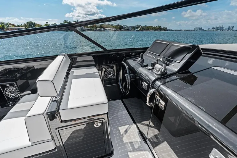 Slide: The Image of Luxurious 2021 VanDutch 40.2 yacht interior with sleek dashboard and comfortable seating. - 14