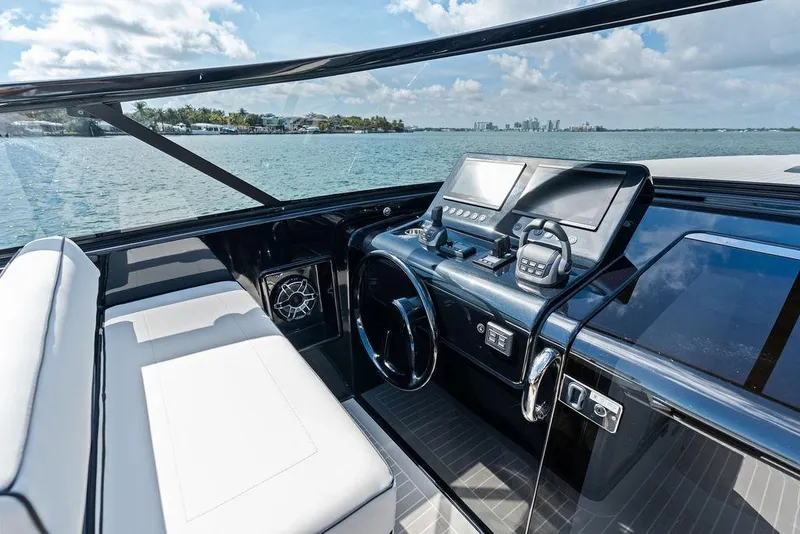Slide: The Image of Luxurious VanDutch 40.2 yacht cockpit with modern controls, overlooking serene waters. - 15