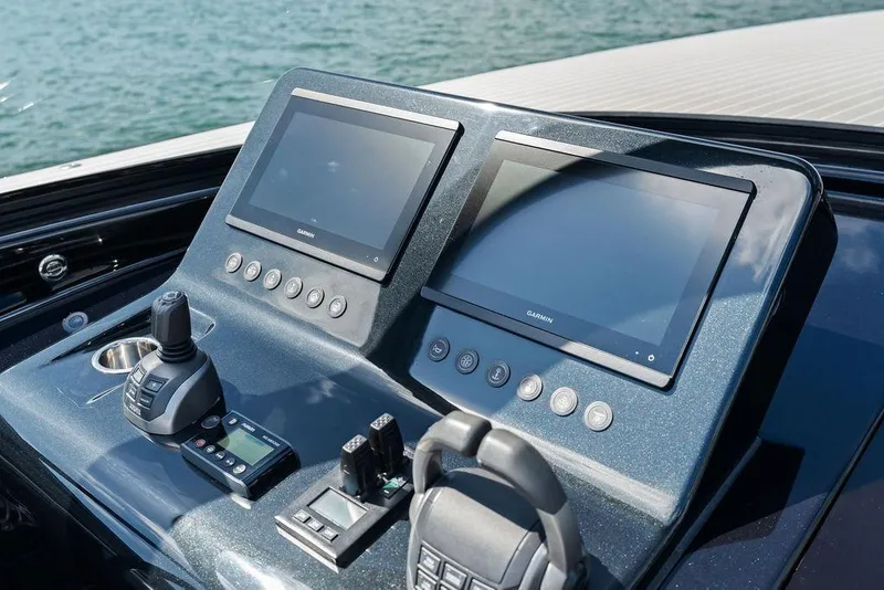 Slide: The Image of Control panel of 2021 VanDutch 40.2 yacht with dual Garmin displays. - 16