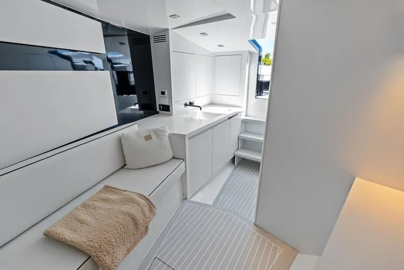 Slide: The Image of Luxurious interior of 2021 VanDutch 40.2 yacht with modern white design and cozy seating. - 19