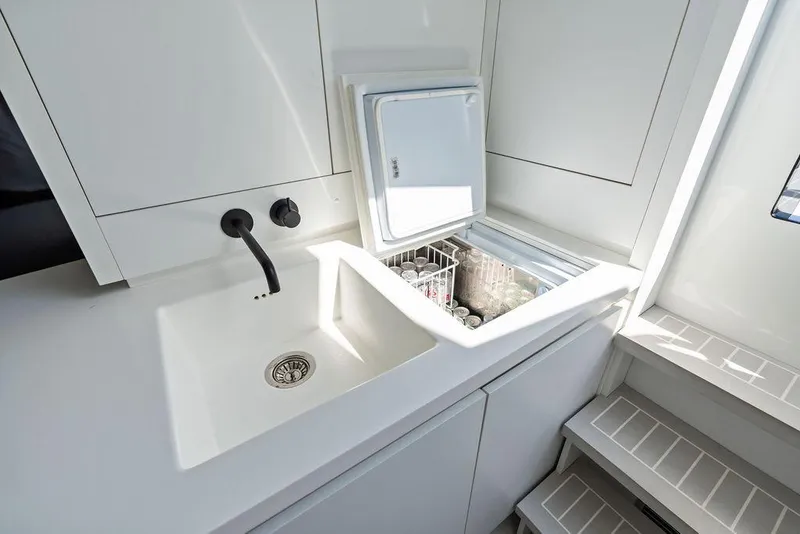 Slide: The Image of Modern kitchen area in 2021 VanDutch 40.2 yacht with sink and built-in cooler. - 20