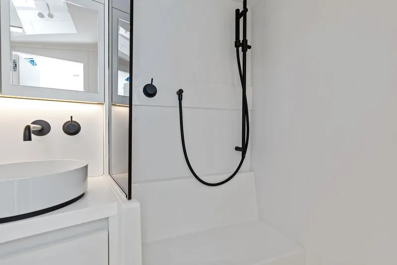 Slide: The Image of Modern bathroom interior on a 2021 VanDutch 40.2 yacht, featuring sleek fixtures and minimalist design. - 22