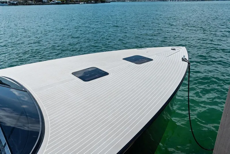 Slide: The Image of VanDutch 40.2 yacht, 2021 model, docked on calm water with sleek design. - 3