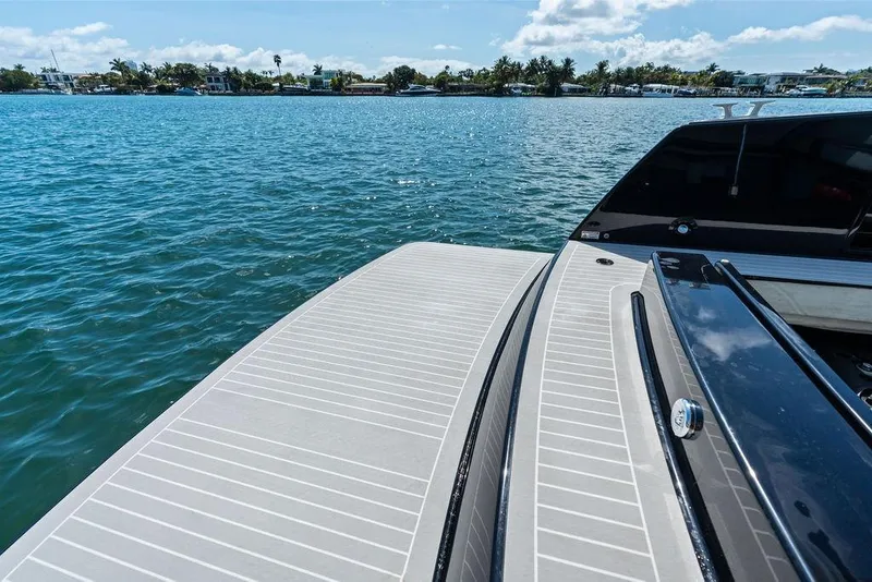 Slide: The Image of VanDutch 40.2 yacht deck overlooking serene blue waters, 2021 model. - 4