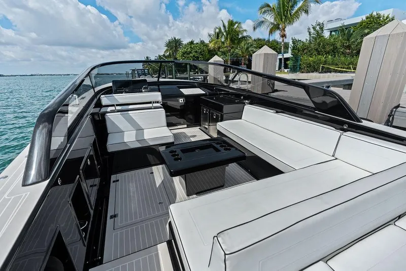 Slide: The Image of Luxurious 2021 VanDutch 40.2 yacht interior with sleek seating and ocean view. - 7
