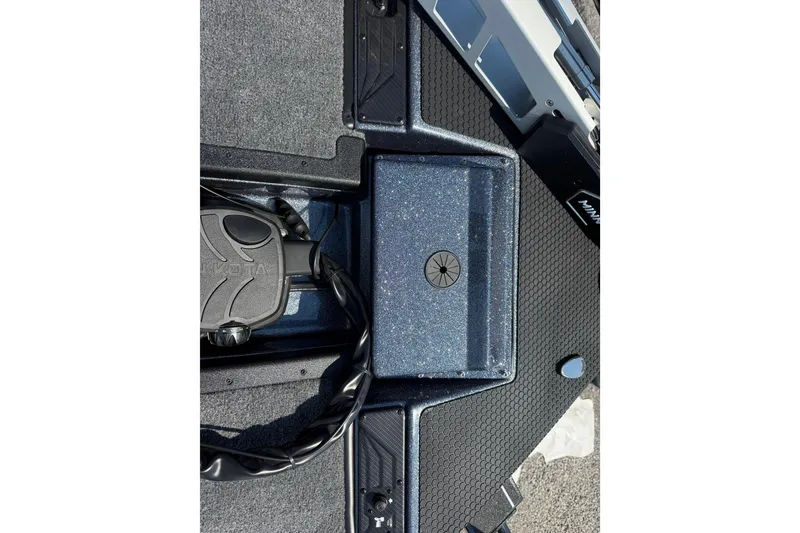 Slide: The Image of 2026 Phoenix 721 ZXL boat deck with Minn Kota foot pedal and textured flooring. - 14