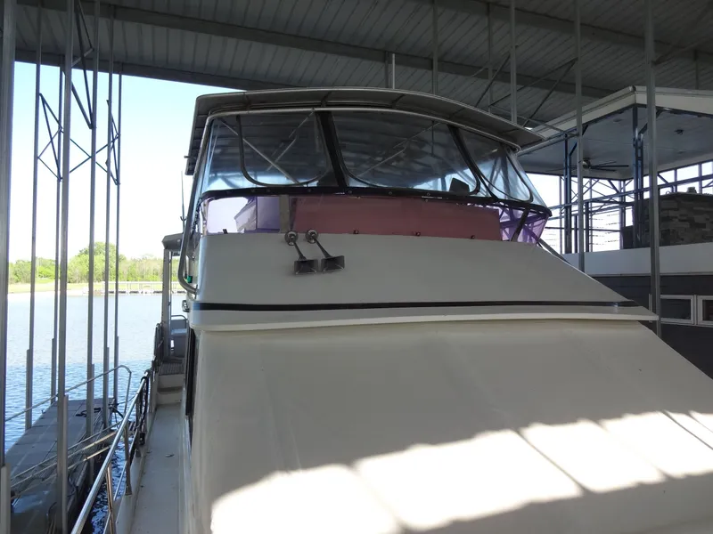 Slide: The Image of 1996 President 545 yacht docked under a canopy. - 10