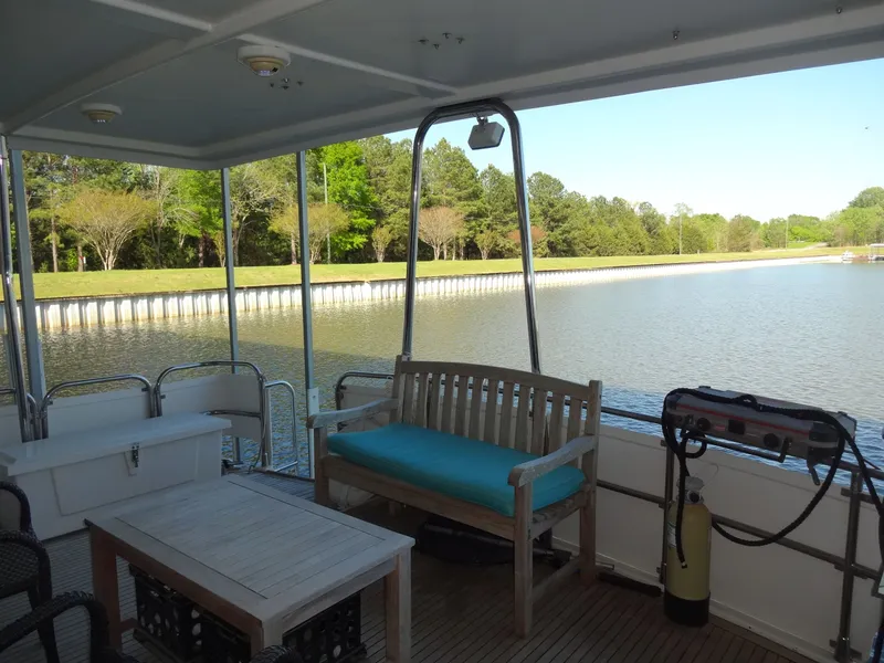 Slide: The Image of Deck of a 1996 President 545 boat with lake view. - 11