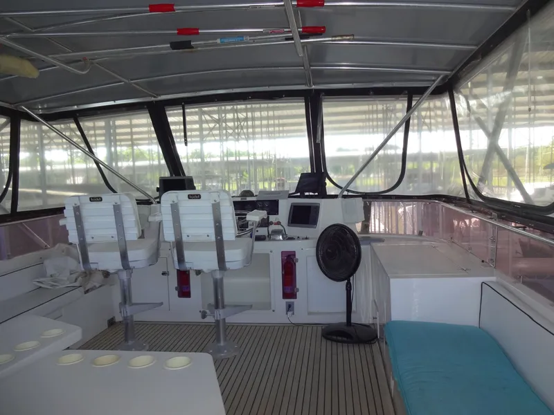 Slide: The Image of Interior of a 1996 President 545 yacht with helm station. - 17
