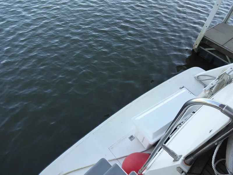 Slide: The Image of 1996 President 545 boat docked by the water. - 22