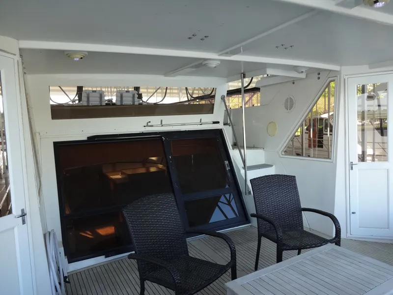 Slide: The Image of Interior of a 1996 President 545 yacht with seating area. - 23