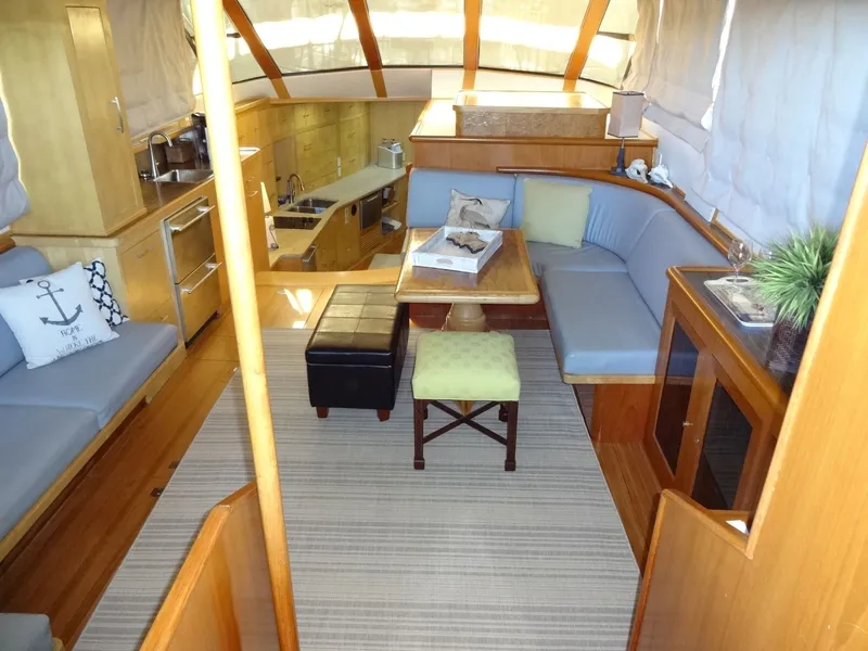 Slide: The Image of Interior of a 1996 President 545 yacht with cozy seating area. - 25