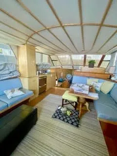 Slide: The Image of Interior of a 1996 President 545 yacht with cozy seating area. - 26