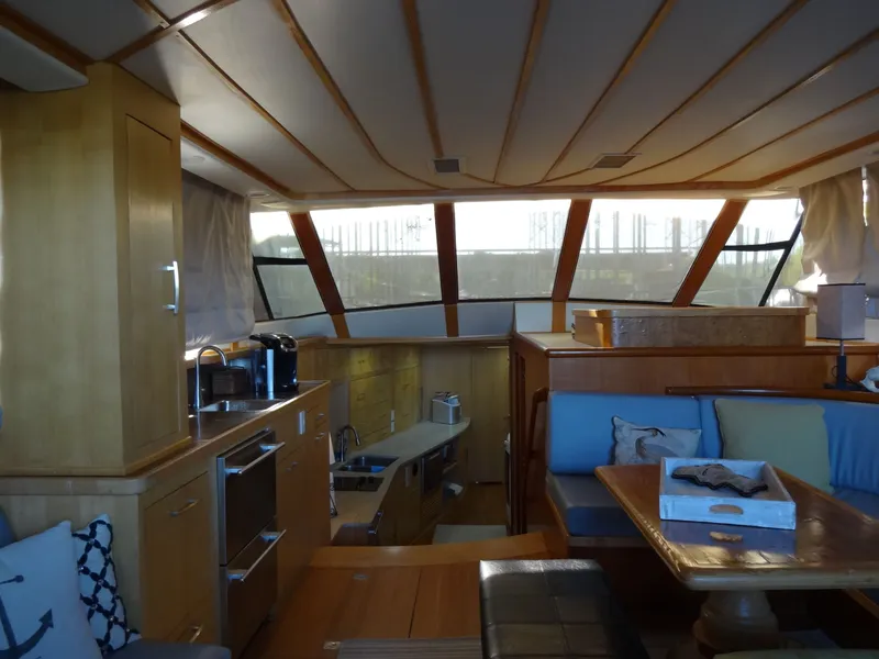 Slide: The Image of Interior of a 1996 President 545 yacht with kitchen and seating area. - 27