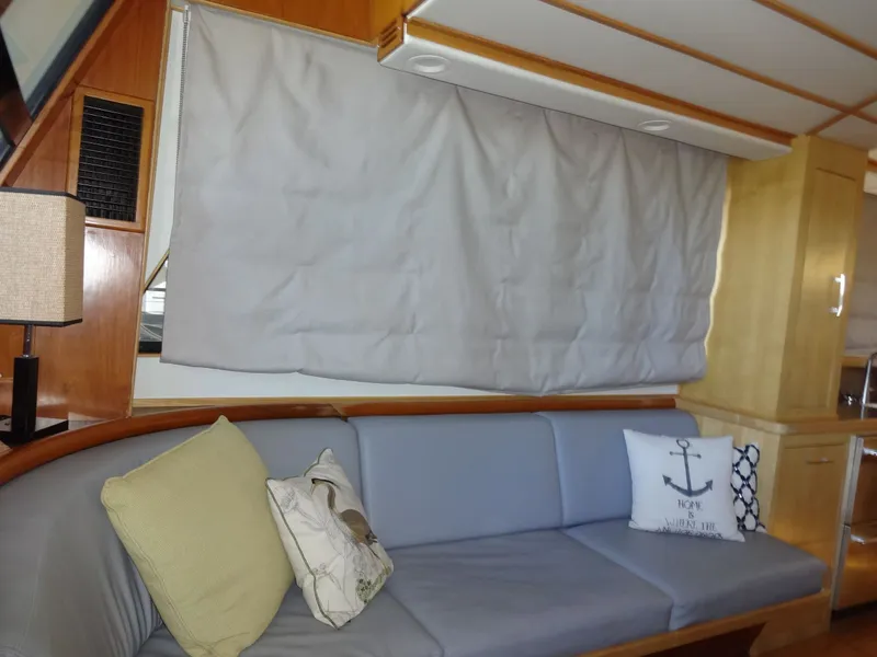 Slide: The Image of Interior of a 1996 President 545 yacht with sofa and cushions. - 32