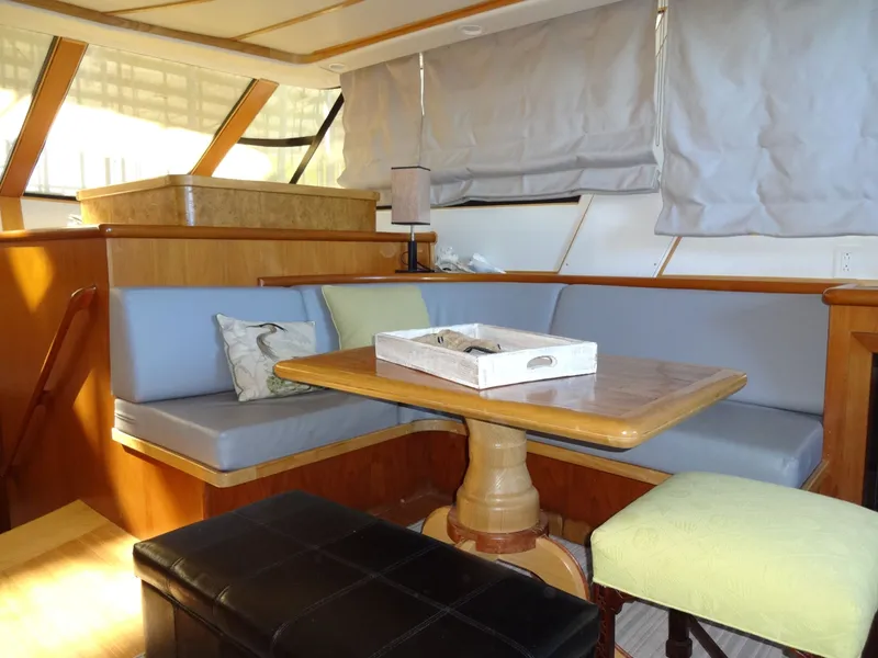Slide: The Image of Interior of a 1996 President 545 yacht with cozy seating area. - 33